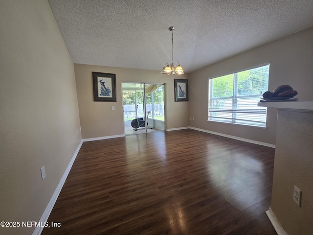 3472 Steelgate Ct, Middleburg, FL 32068 - spare room featuring a textured ceiling, dark wood-style floors, and plenty of natural light