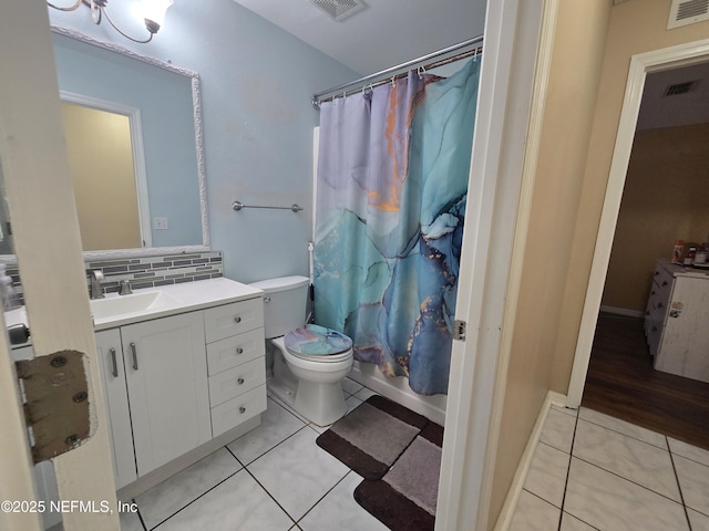 3472 Steelgate Ct, Middleburg, FL 32068 - bathroom with tile patterned floors, vanity, and backsplash