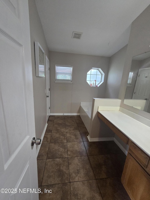 3472 Steelgate Ct, Middleburg, FL 32068 - bathroom with a bath, tile patterned floors, and vanity
