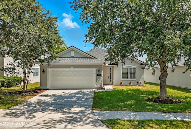 12191 Wynnfield Lakes Cir, Jacksonville, FL 32246 - ranch-style house featuring an attached garage, driveway, stucco siding, a front lawn, and roof with shingles