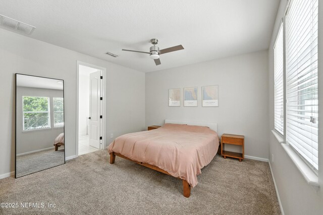 12191 Wynnfield Lakes Cir, Jacksonville, FL 32246 - carpeted bedroom featuring baseboards and ceiling fan