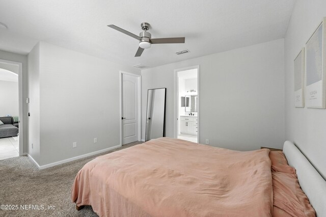 12191 Wynnfield Lakes Cir, Jacksonville, FL 32246 - bedroom featuring arched walkways, carpet flooring, ensuite bath, and a ceiling fan