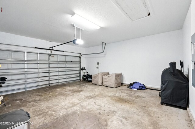 12191 Wynnfield Lakes Cir, Jacksonville, FL 32246 - garage with a garage door opener and baseboards