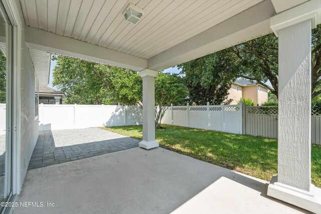 12191 Wynnfield Lakes Cir, Jacksonville, FL 32246 - fenced backyard with a patio