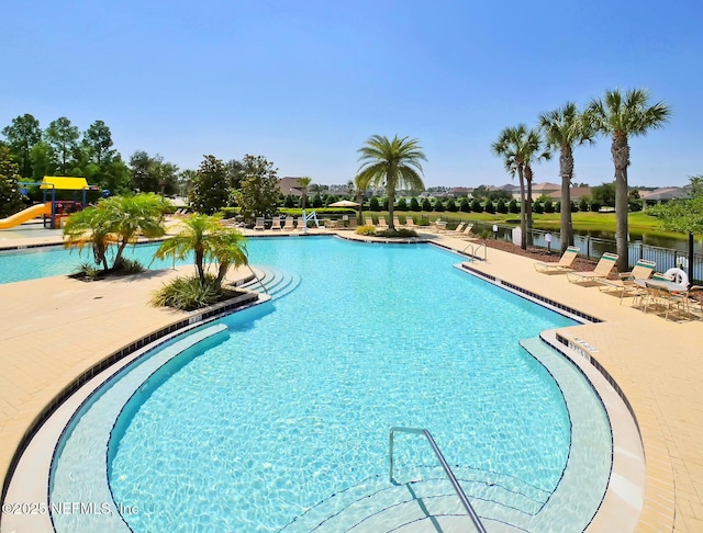 12191 Wynnfield Lakes Cir, Jacksonville, FL 32246 - community pool featuring a water slide and a patio