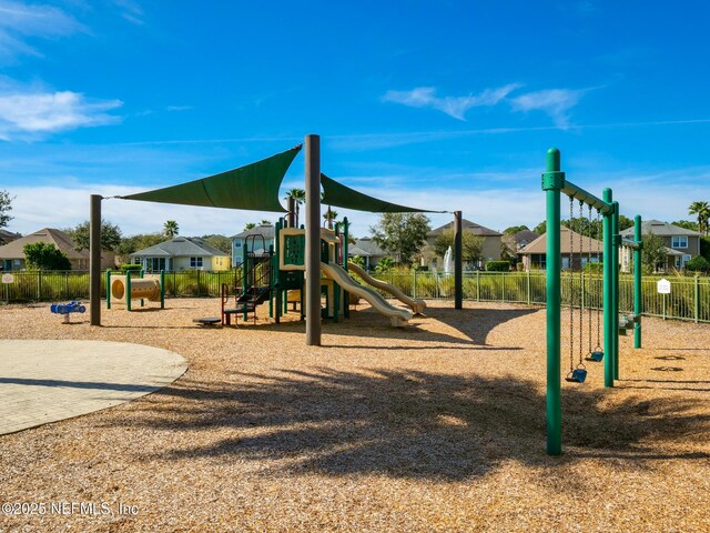 12191 Wynnfield Lakes Cir, Jacksonville, FL 32246 - communal playground featuring a residential view
