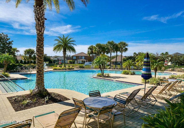 12191 Wynnfield Lakes Cir, Jacksonville, FL 32246 - community pool featuring a patio