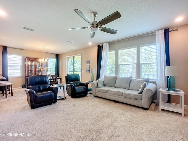 132 Yellowfin Dr, Saint Augustine, FL 32095 - carpeted living room featuring a chandelier and ceiling fan