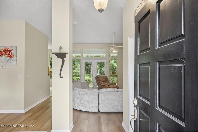 6992 Tonga Dr, Jacksonville, FL 32216 - entrance foyer featuring french doors, light wood finished floors, and ceiling fan