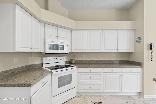 6992 Tonga Dr, Jacksonville, FL 32216 - kitchen with white appliances, white cabinetry, and a textured ceiling