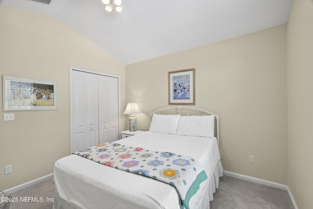 6992 Tonga Dr, Jacksonville, FL 32216 - bedroom with light colored carpet, lofted ceiling, and a closet