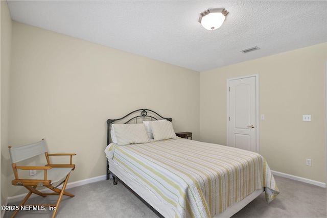 6992 Tonga Dr, Jacksonville, FL 32216 - bedroom featuring carpet and a textured ceiling