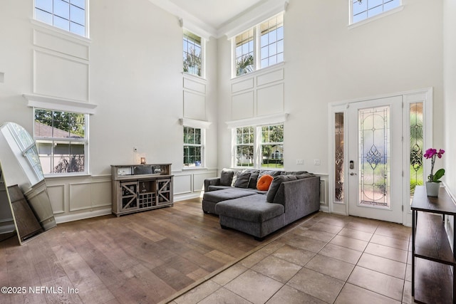 738 W Kings College Dr, Fruit Cove, FL 32259 - living area featuring a towering ceiling, plenty of natural light, and a decorative wall