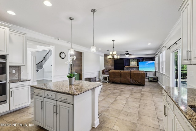 738 W Kings College Dr, Fruit Cove, FL 32259 - kitchen featuring ceiling fan, a decorative wall, crown molding, recessed lighting, and pendant lighting