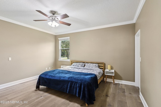 738 W Kings College Dr, Fruit Cove, FL 32259 - bedroom featuring wood finished floors, ornamental molding, a textured ceiling, and ceiling fan