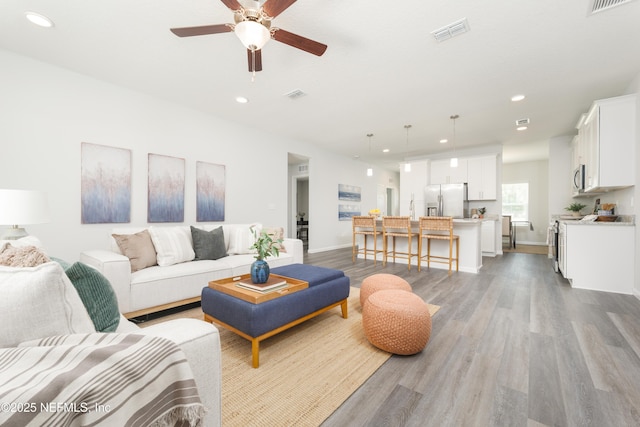 380 Jefferson Rd, Jacksonville, FL 32225 - living area with wood finished floors, ceiling fan, and recessed lighting