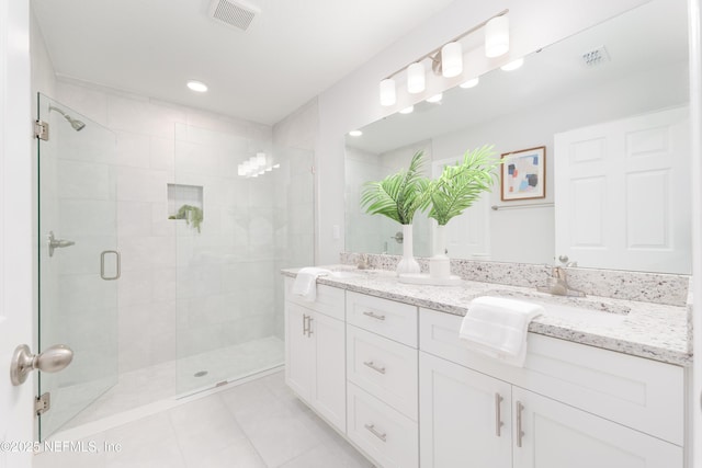 380 Jefferson Rd, Jacksonville, FL 32225 - bathroom with double vanity, tile patterned flooring, a stall shower, and recessed lighting