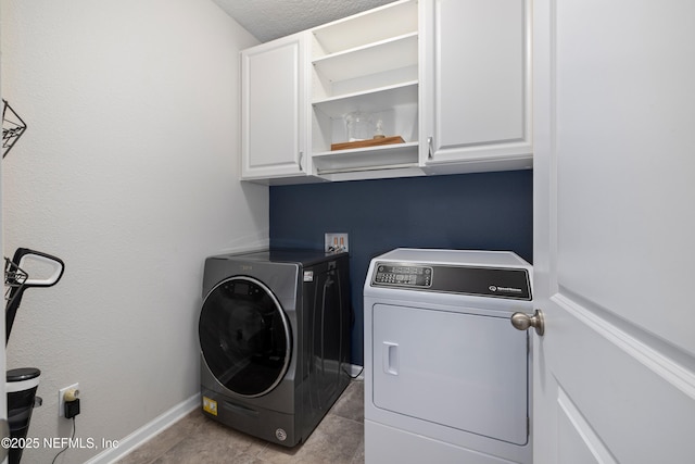 111 Beam Ln, Saint Augustine, FL 32095 - laundry room with washing machine and dryer, cabinet space, and tile patterned flooring