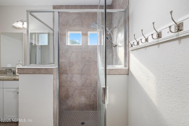 111 Beam Ln, Saint Augustine, FL 32095 - full bathroom featuring vanity, a shower stall, and a textured wall