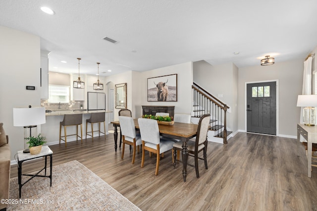 111 Beam Ln, Saint Augustine, FL 32095 - dining room featuring wood finished floors, recessed lighting, and stairway