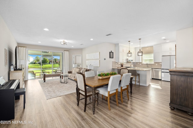 111 Beam Ln, Saint Augustine, FL 32095 - dining area with light wood-style floors and recessed lighting