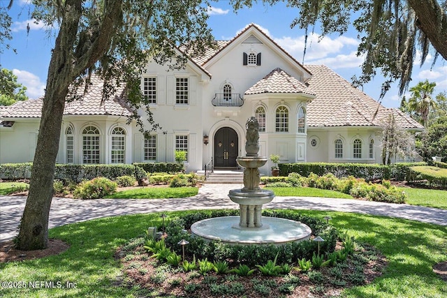24736 Harbour View Dr, Ponte Vedra Beach, FL 32082 - mediterranean / spanish home with a tile roof, stucco siding, and a front lawn