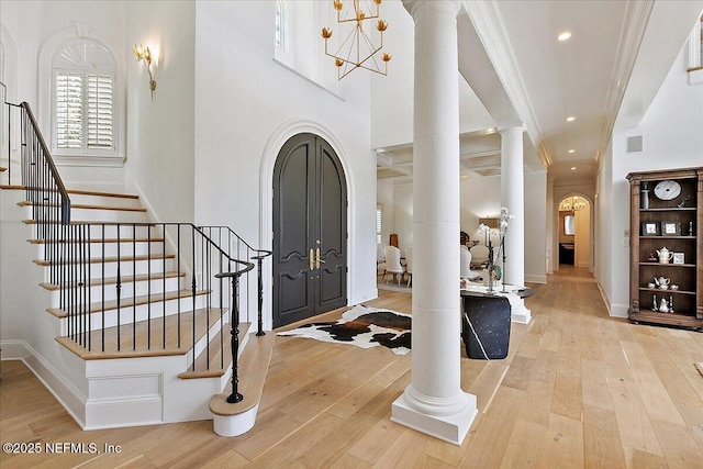 24736 Harbour View Dr, Ponte Vedra Beach, FL 32082 - foyer entrance featuring decorative columns, wood-type flooring, stairs, and recessed lighting