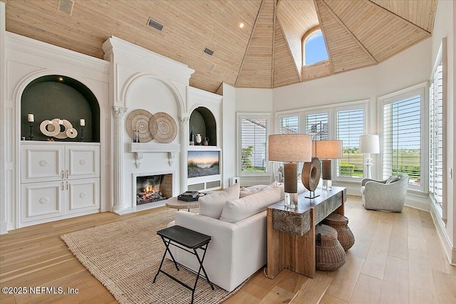 24736 Harbour View Dr, Ponte Vedra Beach, FL 32082 - living room with wooden ceiling, high vaulted ceiling, a large fireplace, light wood-type flooring, and built in features