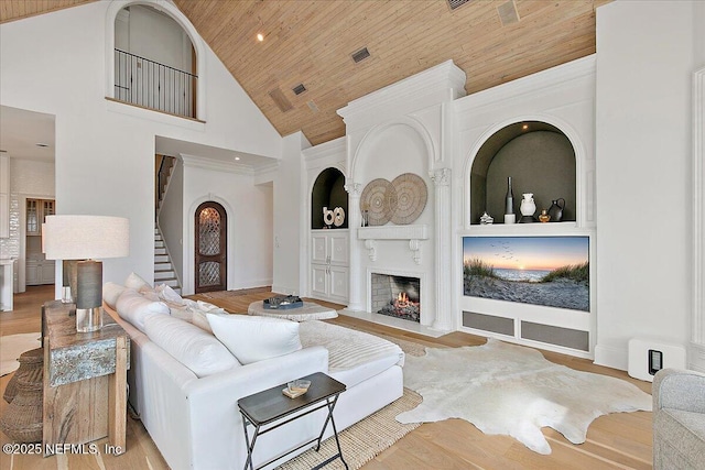 24736 Harbour View Dr, Ponte Vedra Beach, FL 32082 - living area with wooden ceiling, stairway, high vaulted ceiling, a high end fireplace, and wood finished floors