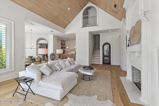 24736 Harbour View Dr, Ponte Vedra Beach, FL 32082 - living room with wood ceiling, a chandelier, hardwood / wood-style flooring, stairs, and high vaulted ceiling