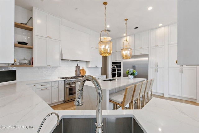 24736 Harbour View Dr, Ponte Vedra Beach, FL 32082 - kitchen with open shelves, premium appliances, white cabinetry, decorative backsplash, and recessed lighting