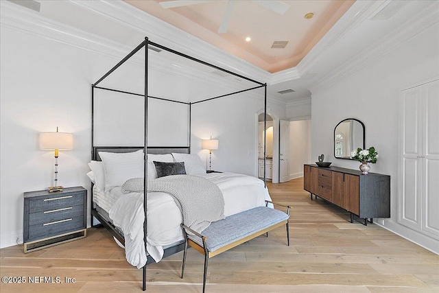 24736 Harbour View Dr, Ponte Vedra Beach, FL 32082 - bedroom featuring light wood-style flooring, arched walkways, crown molding, and recessed lighting