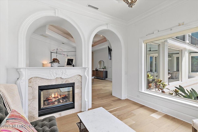 24736 Harbour View Dr, Ponte Vedra Beach, FL 32082 - living area with ornamental molding, wood finished floors, and a premium fireplace