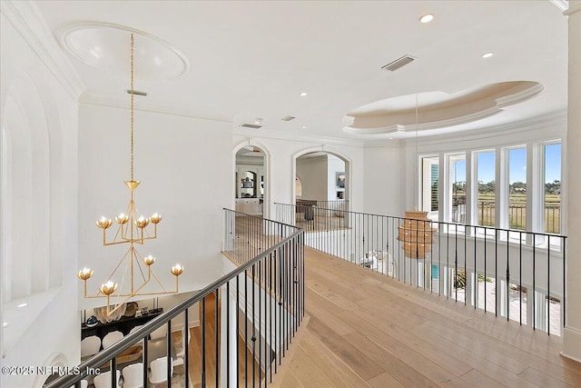 24736 Harbour View Dr, Ponte Vedra Beach, FL 32082 - hallway featuring crown molding, a chandelier, a water view, arched walkways, and recessed lighting