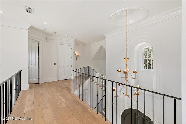 24736 Harbour View Dr, Ponte Vedra Beach, FL 32082 - hallway with an upstairs landing, a chandelier, light wood-type flooring, crown molding, and recessed lighting