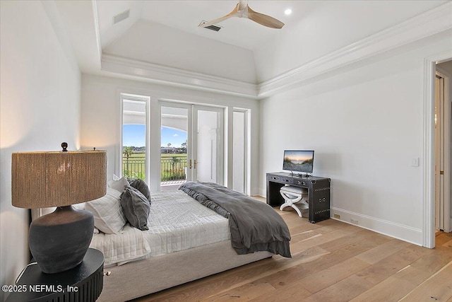 24736 Harbour View Dr, Ponte Vedra Beach, FL 32082 - bedroom with access to exterior, a tray ceiling, light wood-style flooring, and ceiling fan