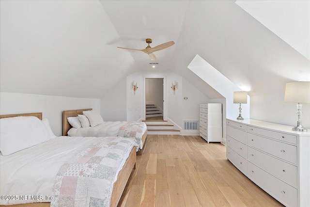 24736 Harbour View Dr, Ponte Vedra Beach, FL 32082 - bedroom featuring light wood-style flooring, vaulted ceiling, and ceiling fan