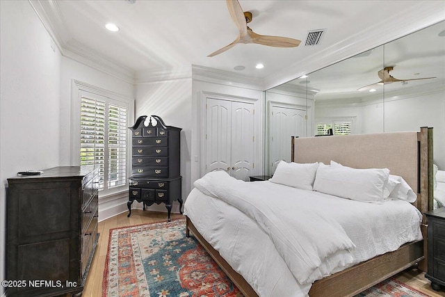 24736 Harbour View Dr, Ponte Vedra Beach, FL 32082 - bedroom featuring ornamental molding, wood finished floors, multiple closets, ceiling fan, and recessed lighting