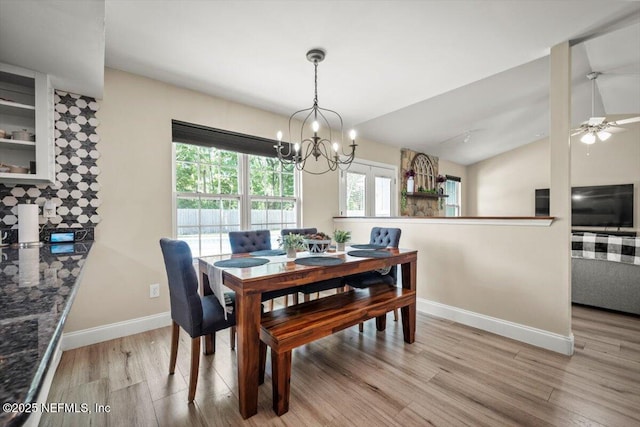 2168 Minorcan St, Middleburg, FL 32068 - dining space featuring wood finished floors, a chandelier, lofted ceiling, and ceiling fan