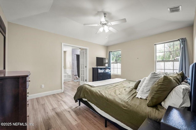 2168 Minorcan St, Middleburg, FL 32068 - bedroom with light wood-style floors, a ceiling fan, and connected bathroom