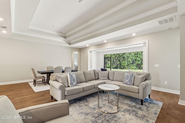 613 Witty Banter Ct, Yulee, FL 32097 - living room with a raised ceiling, crown molding, wood finished floors, and recessed lighting