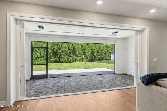 613 Witty Banter Ct, Yulee, FL 32097 - doorway to outside featuring wood finished floors and recessed lighting