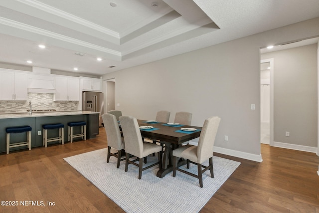 613 Witty Banter Ct, Yulee, FL 32097 - dining area featuring ornamental molding, a tray ceiling, dark wood-style floors, and recessed lighting