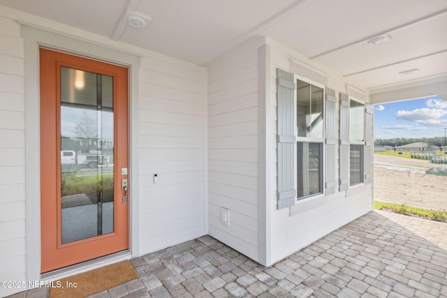 613 Witty Banter Ct, Yulee, FL 32097 - entrance to property featuring a porch