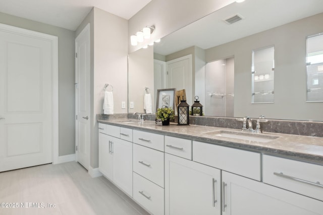 613 Witty Banter Ct, Yulee, FL 32097 - full bathroom featuring double vanity, tile patterned floors, and tiled shower