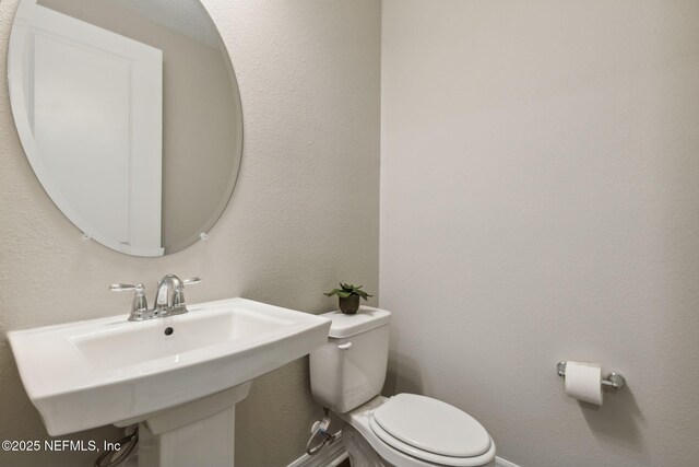 613 Witty Banter Ct, Yulee, FL 32097 - half bath featuring a sink and toilet