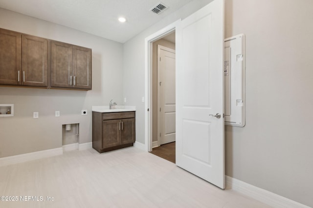 613 Witty Banter Ct, Yulee, FL 32097 - washroom featuring hookup for an electric dryer, cabinet space, hookup for a washing machine, and recessed lighting