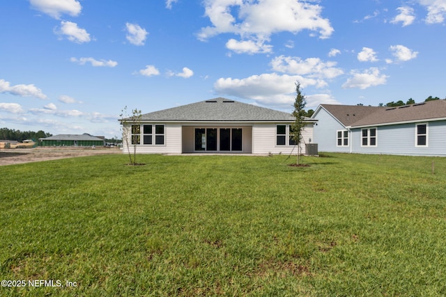 613 Witty Banter Ct, Yulee, FL 32097 - rear view of property featuring a lawn