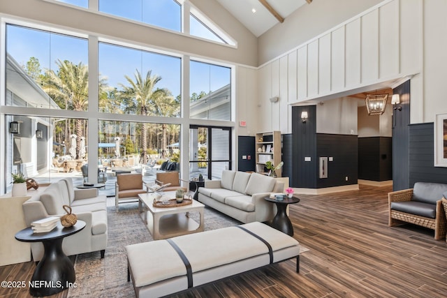613 Witty Banter Ct, Yulee, FL 32097 - living room with high vaulted ceiling, a chandelier, and wood finished floors