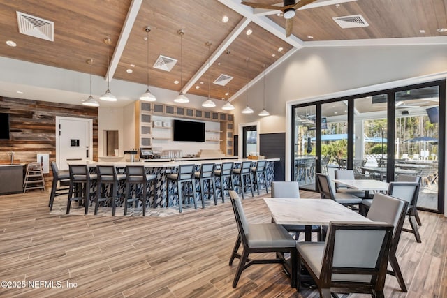 613 Witty Banter Ct, Yulee, FL 32097 - dining area with high vaulted ceiling, a wood ceiling with exposed beams, light wood-style floors, and a ceiling fan